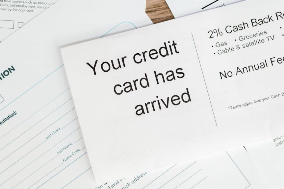 close up of a letter announcing the arrival of a credit card amidst financial documents