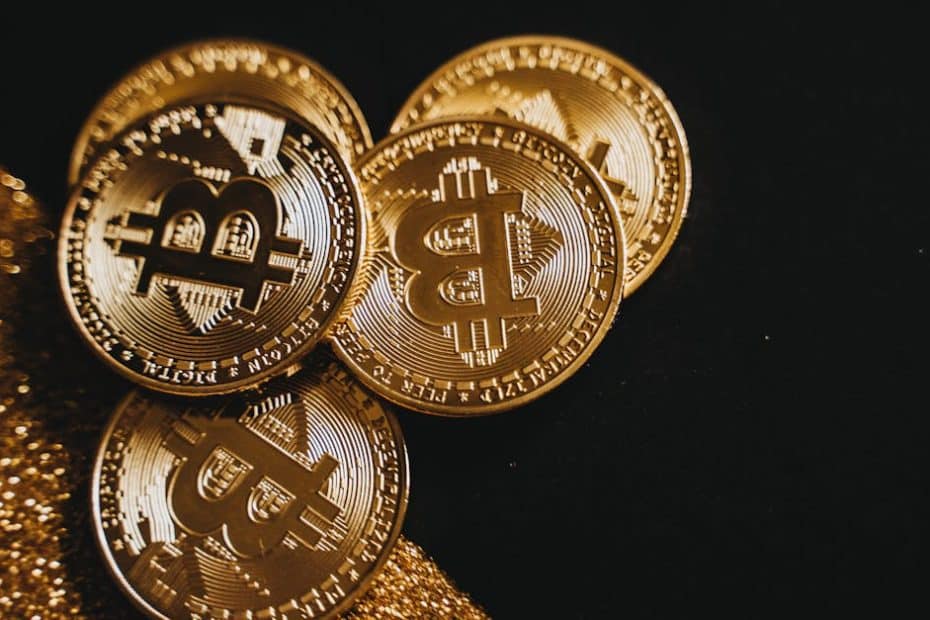 a detailed close up shot of shiny bitcoin coins resting on a glittery surface symbolizing wealth in